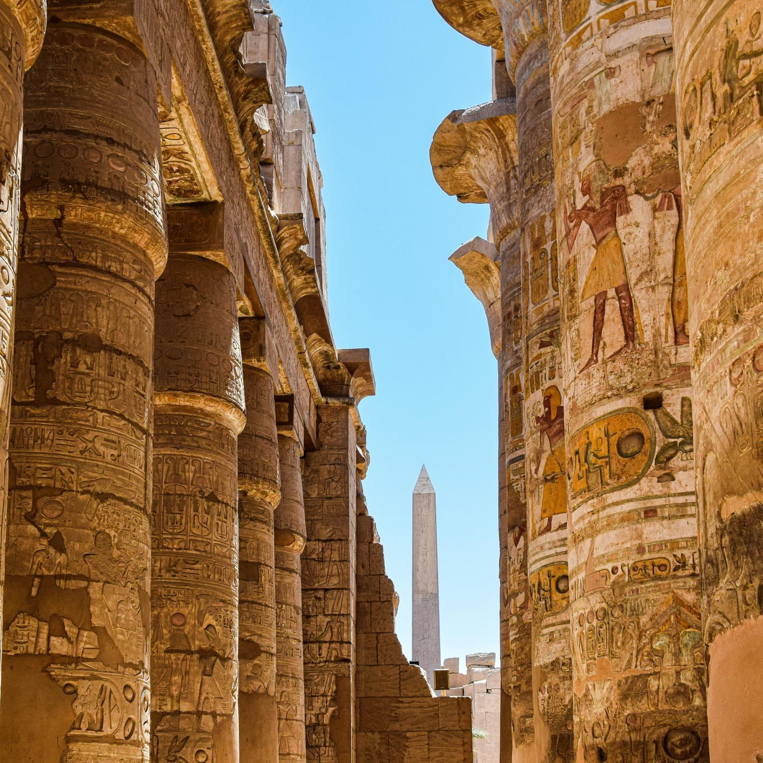 Explore the majestic columns and hieroglyphs at Karnak Temple in Egypt.