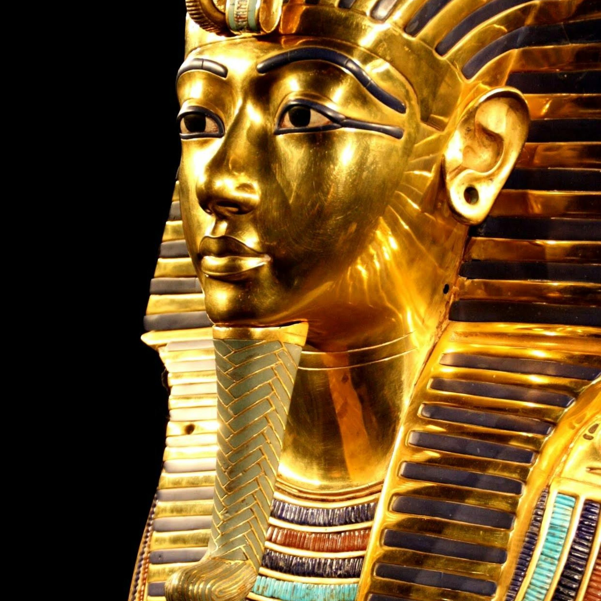 Close-up of Tutankhamun's gilded death mask showcasing intricate design.